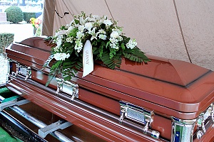 Funeral casket for a love one displayed outdoors ceremony